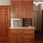 Beverage center in kitchen with built in coffee maker