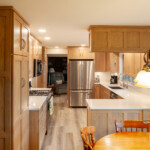 custom kitchen with natural wood finish cabinets